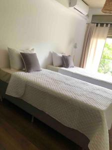 A bed or beds in a room at Casi a nuevo, moderno y bien ubicado