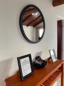 a mirror sitting on top of a wooden table at Lo de Lili in Colón