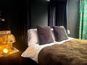 A bed or beds in a room at The Wizards House York - discounts for long stays