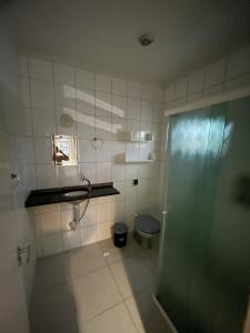 a bathroom with a shower and a toilet at Quarto Duplo Costa brava in Guarujá