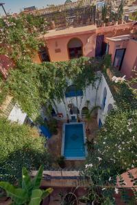 an overhead view of a house with a garden at Riad Chameleon in Marrakech