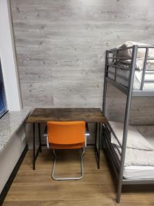 a room with a desk and a bunk bed at Rooms4Rest Bokserska - Private rooms for tourists - ATR Consulting Sp, z o,o, in Warsaw