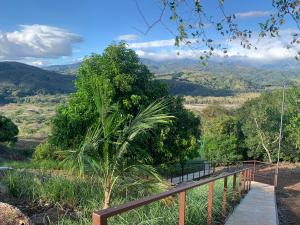 a wooden walkway with a view of a mountain at Conectar con la naturaleza in Esparza