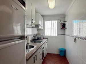 Kuchyň nebo kuchyňský kout v ubytování Apartamentos Maria