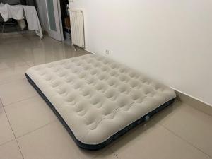a mattress sitting on the floor in a room at Hotel Paris Nord in Paris