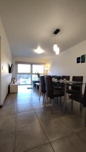 a dining room with a table and chairs at 3 amb en zona Guemes. A pasos del Aldrey y bares. in Mar del Plata