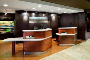 a lobby with two counters in a store at Courtyard by Marriott State College in State College