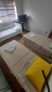 Cama o camas de una habitación en Prato Feito Restaurante, Hotel e Pousada