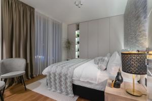 Postel nebo postele na pokoji v ubytování Melody Apartment
