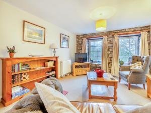 a living room with a couch and a table at Cauldron Falls in West Burton