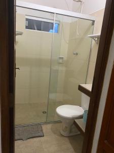 a bathroom with a glass shower with a toilet at Casa Rural Doña Blanca in Samaipata