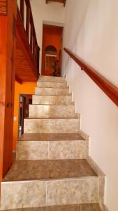 a stairway in a house with a stair case at La Mar in Mar de Ajó