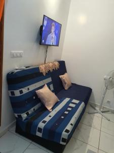 Un pat sau paturi într-o cameră la Bungalow vacances