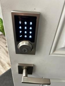 a close up of a door with a security alarm at Comfortable room C in Kitchener