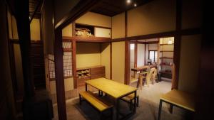a room with a table and some chairs in it at Maison d'hôtes KIRISIMIZU - Vacation STAY 40997v in Nagano