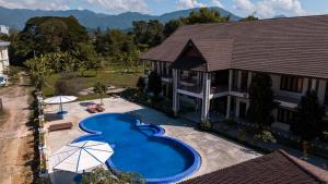 an aerial view of a house with a swimming pool at Vang Vieng Garden Resort in Vang Vieng