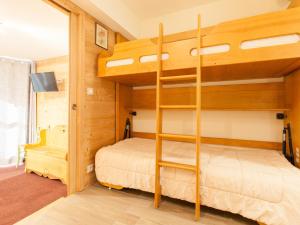 a bunk bed in a room with a bunk bed in a house at Studio Avoriaz, 1 pièce, 4 personnes - FR-1-314-236 in Morzine