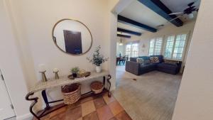 a living room with a mirror and a couch at LV217 Superb 2 Bedroom Overlooking the Lap Pool in La Quinta +20 photos