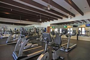 a gym with several treadmills and cardio machines at LV217 Superb 2 Bedroom Overlooking the Lap Pool in La Quinta
