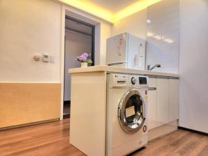 a washer and dryer in a room at Seochon Dalbit in Seoul