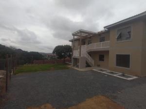 a house with a balcony and a yard at KaMageba Palace in Durban