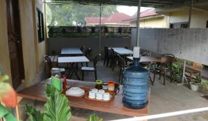 a large bottle of water sitting on top of a table at Tange Guest House in Ruteng