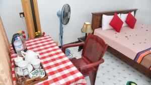 Postel nebo postele na pokoji v ubytování Prem Nadee Homestay
