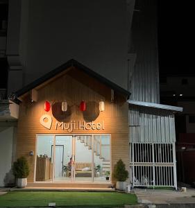 a mott hotel sign on the side of a building at Muji Hotel KrabI in Krabi town