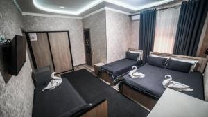 Ένα ή περισσότερα κρεβάτια σε δωμάτιο στο Hotel Madera +10 φωτογραφίες