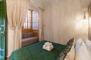 Postel nebo postele na pokoji v ubytování Riad contessa