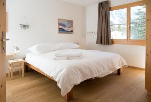 Letto o letti in una camera di Holiday flat for 6 people Sot Valos Lenzerheide centre