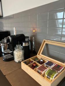 a wooden tray filled with different types of food at Urban Charm Design Loft in Koblenz +16 photos