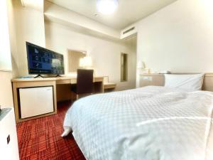 Letto o letti in una camera di Yokote Central Hotel