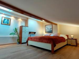 a bedroom with a bed and a dresser at Krakow Old Town Apartment in Krakow