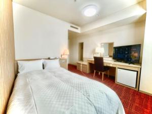Postel nebo postele na pokoji v ubytování Yokote Central Hotel + 21 fotografií