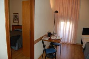 Una televisión o centro de entretenimiento en Hotel Nuova Grosseto