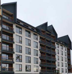 an image of an apartment building with balconies at Harmony, Residence Hill A85 in Kopaonik