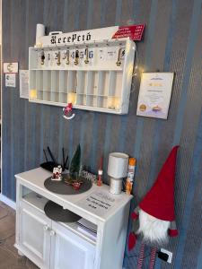 a room with a santa hat on a shelf at Jager Guesthouse in Sopron