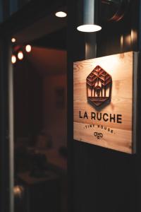 a sign that reads la rouge tiny house at Tiny House Au Coeur de la Campagne Wallonne in Chaumont-Gistoux