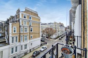 a view of a city street from a balcony at Kensington Studios in London