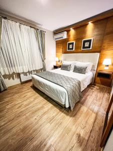 Cama ou camas em um quarto em Hotel Recanto da Serra
