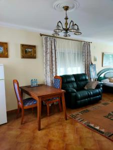 a living room with a table and a couch at Apartments in a "VILLA VISTA JAVEA" in Jávea