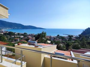 a view of the ocean from the balcony of a house at INROY SEA VIEW APARTMENTS in Skala Potamias