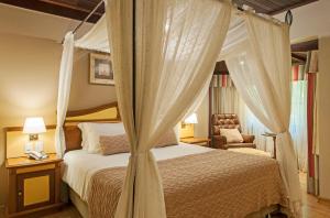 Cama ou camas em um quarto em Hotel Recanto da Serra