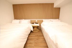 Postel nebo postele na pokoji v ubytování Hotel141
