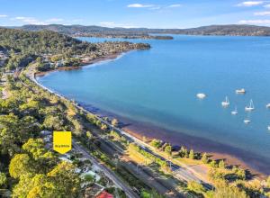 an aerial view of a beach with boats in the water at Water view retreat sanctuary in Koolewong