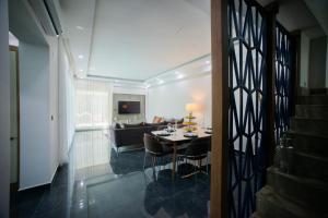 a living room with a table and a couch at Living Dream Villa HARMONY in Belek