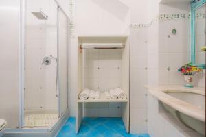 a bathroom with a shower and a sink at Casa Danira - Positano in Positano