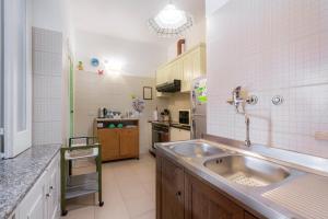 a kitchen with a sink and a counter top at Casa Danira - Positano in Positano