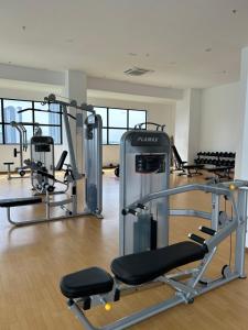 a gym with several tread machines in a room at Edusphere Suites, University of Cyberjaya near Tamarind Square in Cyberjaya